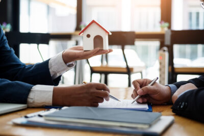 Real estate broker explain contract investment before signing a contract housing estate in office. contract and agreement concept.